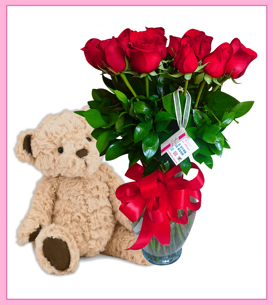 Arreglo floral de rosas rojas con oso de peluche